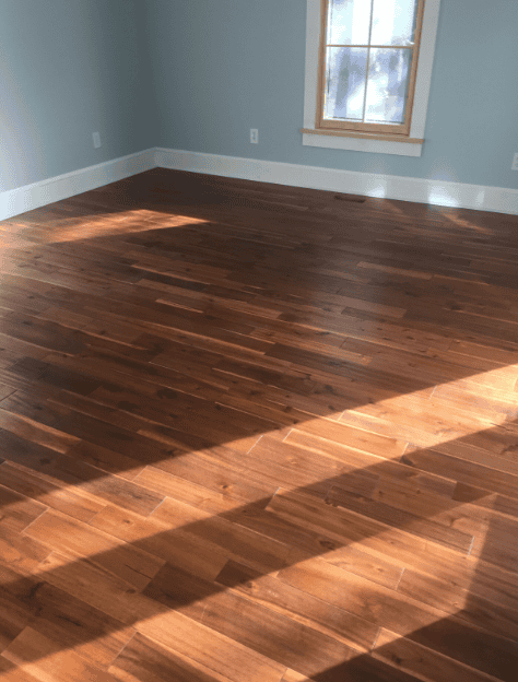 Completed timber flooring with skirting and trim