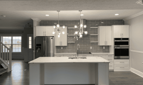 Modern kitchen renovation with island and custom cabinetry