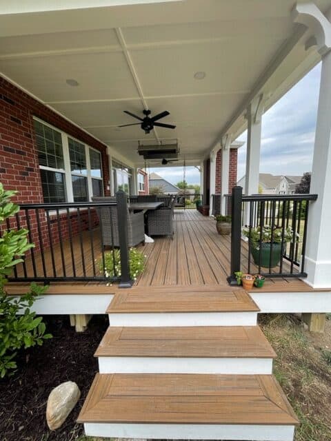 Exterior of a home with porch and completed roofing work
